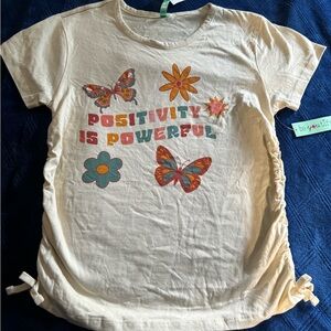 NWT size XL (16) tan tee that says “positivity is powerful”